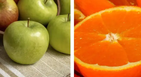 Mele verdi e arancia tagliata a metà. Attenzione, il fruttosio alza la glicemia.